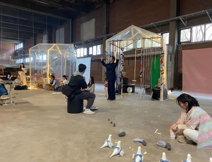 A stage shared by both the actors and the audience
